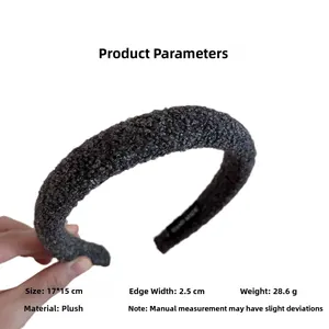 Macro view of grey plush headband with 2.5cm width and handmade label detail