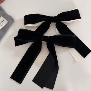 Classic French ballet style velvet bow hair clip with long ribbons on white background