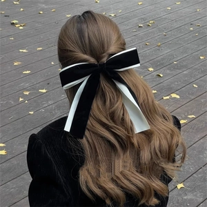 French ballet style velvet bow hair clip in black and white for autumn hairstyles
