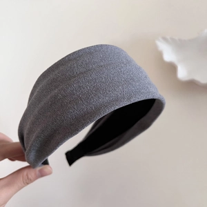 Fashionable dark grey wide knit headband for women featuring textured fabric and retro style