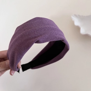 Detail of deep purple velvet wide headband with soft texture and black non-slip lining