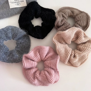 Five-piece soft knit mohair scrunchies set in neutral tones for elegant low ponytail styling