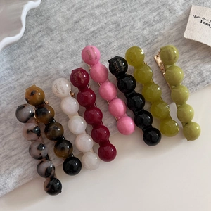 Lot de 7 barrettes rondes en acétate coloré aux motifs écaille et tons vibrants