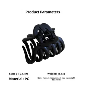 Detail view of matte black hair claw clip showing 6x3.5cm dimensions and 15.6g weight