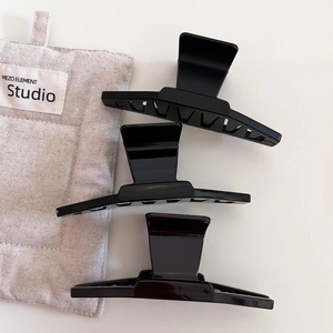 Three-piece set of large black hair claws in matte and glossy finishes for women