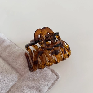 Elegant tortoiseshell pumpkin hair claw clip in amber resin for French half-up hairstyles
