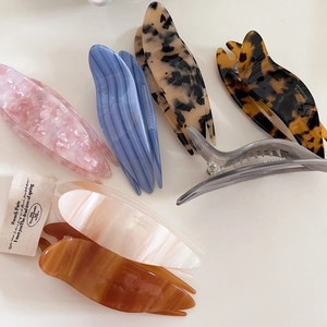 Large acetate swallowtail hair clips in multiple marble and leopard prints for women