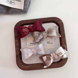 Handmade acetate double-layer bow hair clips in four elegant marbled and solid colors
