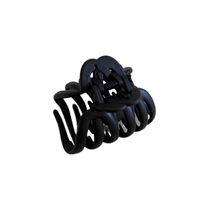 Matte black tortoise shell pumpkin claw clip for half-up hair styles with strong grip