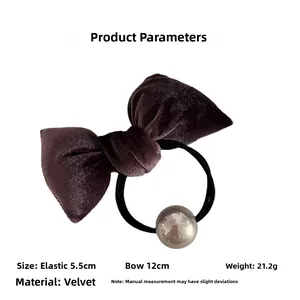 Detail view of brown velvet bow hair tie with silver metallic bead and size specs