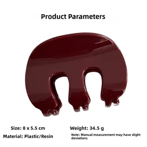 Détail de la pince à cheveux bordeaux avec dimensions 8x5,5cm et poids de 34,5g