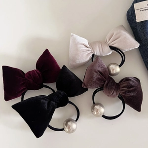 Set of four vintage velvet bow hair ties in burgundy, cream, black, and brown with beads