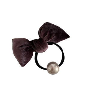 Elegant deep purple velvet bow hair tie with metallic pearl accent for vintage style
