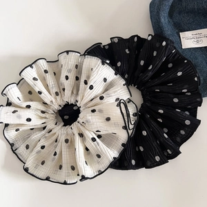 Detailed close-up of oversized double-layer chiffon scrunchies with elegant polka dots