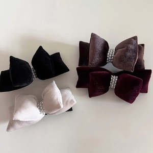 Set of four velvet bow hair clips with pearl details in black, red, grey and brown colors