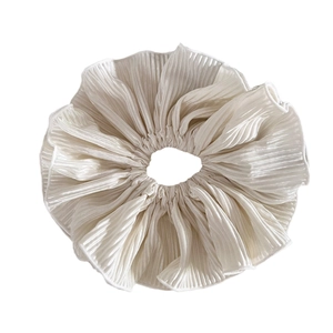 Elegant large white pleated scrunchie with shimmering fabric for low ponytail hairstyles