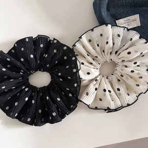 Set of two large polka dot scrunchies in black and white with ruffled fabric textures