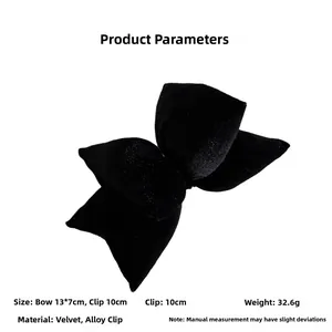 Detail of a plush black velvet bow hair clip with a 10cm sturdy alloy spring clasp