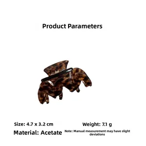 Detail of tortoise shell acetate hair clip showing dimensions 4.7x3.2cm and wave design