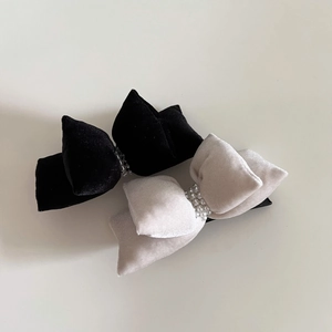 Detailed view of plush velvet bow hair clips with double row pearl beads decoration