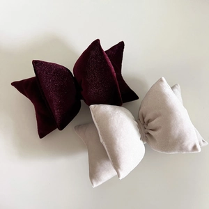 French vintage velvet bow hair clips in wine red and cream white on a white background