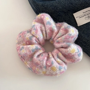 Pink floral plush scrunchie with soft faux fur texture for girls' ponytail styling