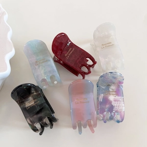 Detailed collection of elegant acetate claw clips in various stylish marble patterns