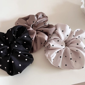 Set of three satin floral scrunchies in black, mocha brown, and ivory white for women