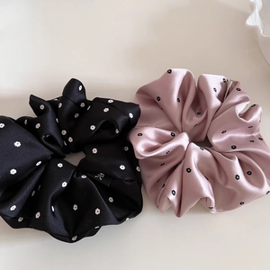 Elegant satin floral scrunchie set in black and pink with smooth glossy finish