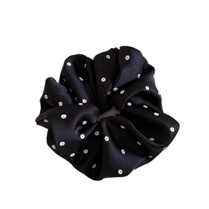 Elegant black satin floral scrunchie with white flower print for low ponytail styles