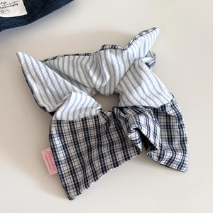 Patchwork plaid and striped oversized scrunchie with a stylish long bow design