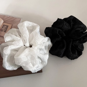 Elegant white and black mesh scrunchies set with embossed polka dot textures