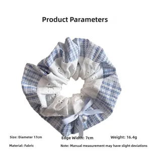 Detail of blue plaid hair scrunchie with lace trim, bow and pearl, 17cm diameter