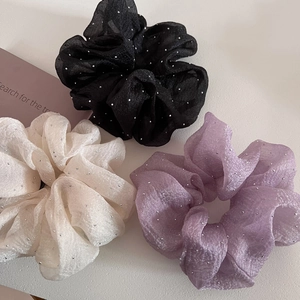 Three-piece set of fluffy organza scrunchies with silver glitter in black, beige, and purple