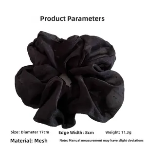 Detail of black large organza scrunchie showing 17cm diameter and 8cm width measurements