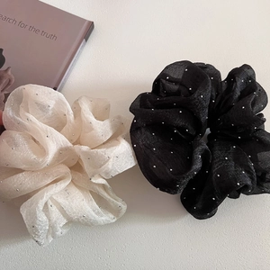 Detail view of puffy seersucker hair scrunchies set with silver glitter dots decoration