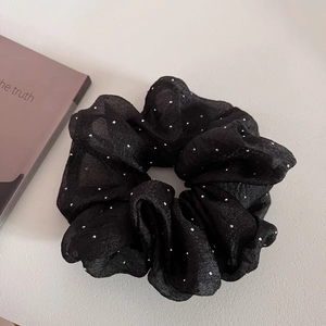 Elegant black seersucker scrunchie with silver sparkling dots for sophisticated hair styling