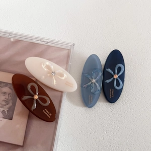 Elegant oval acetate hair clips with crystal bows in cream brown blue and navy colors
