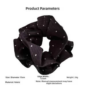 Detail showing dimensions of black heart pattern scrunchie with 15cm diameter