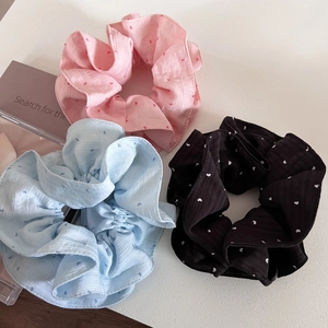 Three-piece set of heart print scrunchies in pink, blue, and black fabric