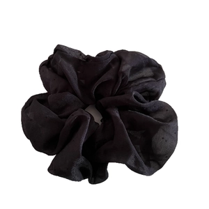 Elegant black polka dot sheer tulle scrunchie for women with soft ruffled texture