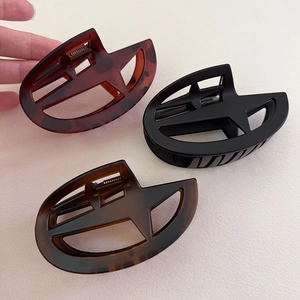 Matte and glossy star-shaped hollow hair claw clips for women in three elegant colors