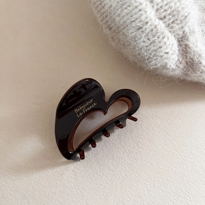 Elegant chocolate brown heart-shaped acetate claw clip with golden text for women