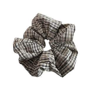 Elegant plaid scrunchie with lace trim for low ponytail or bun hairstyles