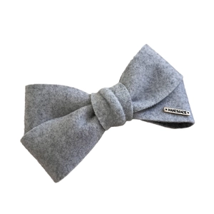 Oatmeal grey soft velvet bow hair clip with a handmade metal tag for elegant women