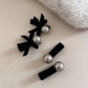 Elegant black velvet bow hair clips set with silver pearls and minimalist metal pins