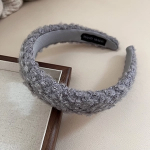 Chic grey lamb wool headband with a soft plush texture for a cozy winter hair accessory