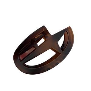 Matte tortoiseshell star hair claw clip with geometric cutout and metal spring