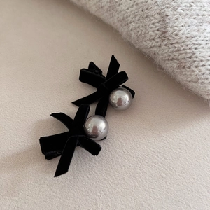 Elegant pair of black velvet bow hair clips with large silver pearls for women's hairstyle