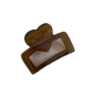 Brown acetate heart claw clip with cream fabric inlay for elegant hairstyles